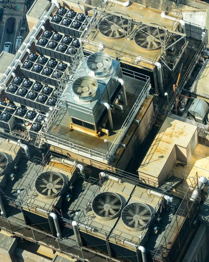 Aerial view of cooling towers and rooftop HVAC equipment on a New York City building