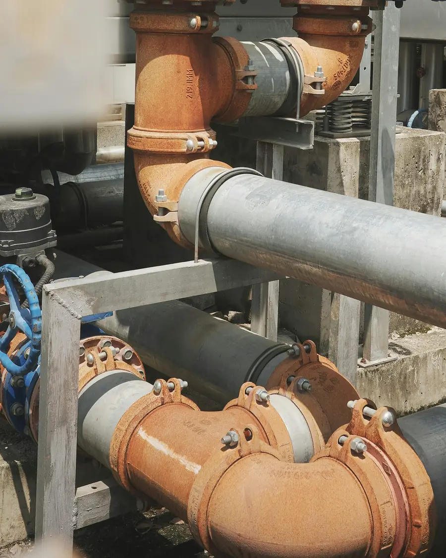 Large-diameter mechanical piping and valves in a commercial plant room